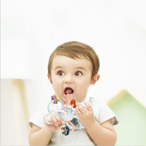 Toddlers grasping teether balls - Image 3